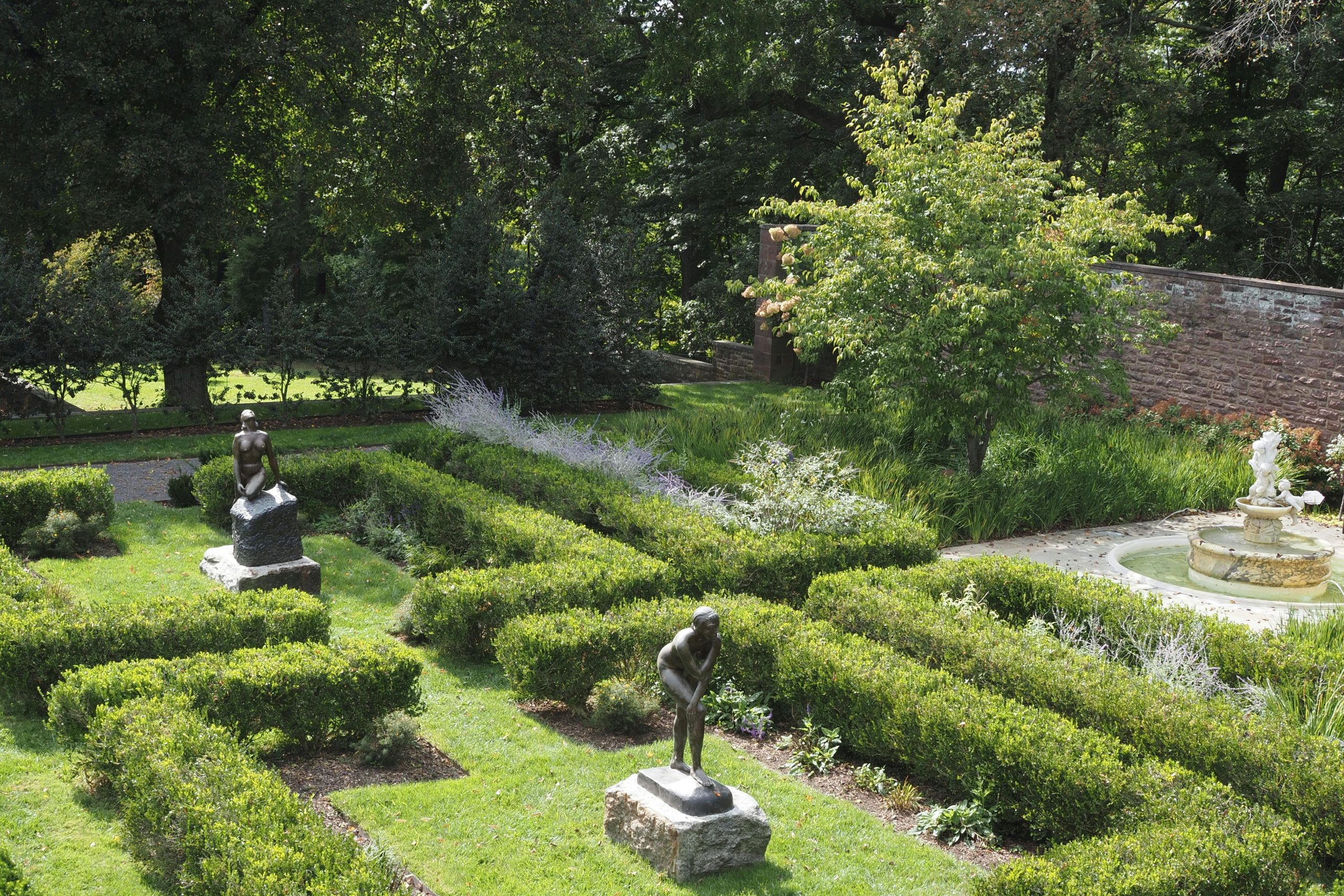Statues and Plants in Garden